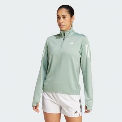 Kurtka Own the Run Half-Zip. Zielone kurtki damskie Adidas, m, bez wzorów, z materiału, bez kaptura. Za 207.75 zł.