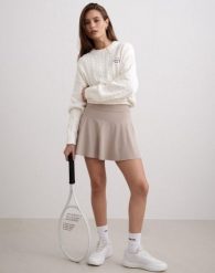 Damski skort wysoki stan, wbudowane szorty, odprowadzający wilgoć Sense beżowy. Brązowe spódnice damskie Aim'n, na co dzień, xs, bez wzorów, z elastanu. Za 208.00 zł.