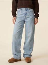 Bawełniane jeansy baggy z efektem sprania - niebieski. Niebieskie jeansy damskie Sinsay. Za 59.99 zł.