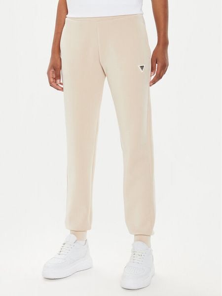 Guess Spodnie dresowe V4YB08 KCAY2 Beżowy Regular Fit. Brązowe spodnie dresowe damskie Guess, xl, z aplikacjami, z dresówki. Za 199.99 zł.