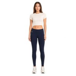 Spodnie damskie Lacoste sportowe treningowe legginsy granatowe. Niebieskie legginsy damskie Lacoste, na lato, uniwersalny, bez wzorów, z elastanu, na fitness i siłownię. Za 357.00 zł.