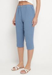 Niebieskie Spodnie Capri z Bawełną i Wysokim Stanem Galirosa. Niebieskie rurki damskie Born2be, bez wzorów, z bawełny, z podwyższonym stanem. Za 39.99 zł.