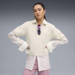 Damska koszulka polo PUMA Class o luźnym kroju PUMA Alpine Snow White. Białe bluzki damskie Puma, bez wzorów, sportowe, bez kołnierzyka, bez ramiączek. Za 129.00 zł.