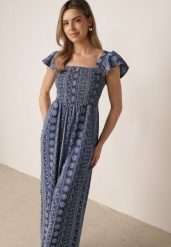 Niebieski Letni Kombinezon Casual z Wiskozy w Etno Haft z Falbankami Paninna. Niebieskie sukienki damskie Born2be, bez wzorów, z tkaniny, boho, bez ramiączek. Za 119.99 zł.