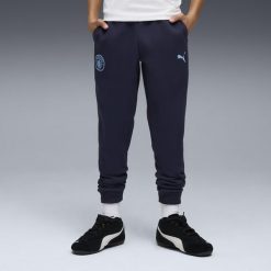Młodzieżowe spodnie Manchester City FtblEssentials PUMA. Niebieskia spodnie sportowe damskie Puma, m, bez wzorów, do piłki nożnej. Za 219.00 zł.