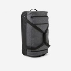 Torba podróżna na kółkach 70 l. Czarne torby podróżne Decathlon, bez wzorów, z tkaniny. Za 249.99 zł.