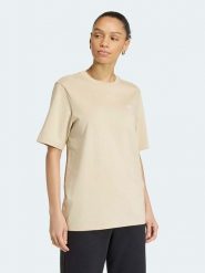 Adidas Koszulka w kolorze beżowym rozmiar: S. Brązowe bluzki damskie Adidas, s, bez wzorów, bez kołnierzyka, bez ramiączek. Za 82.95 zł.