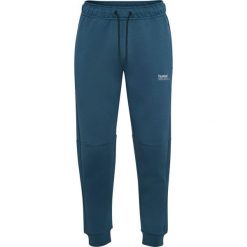 Spodnie dresowe z polaru Hummel Tech Regular. Niebieskie spodnie dresowe damskie Hummel, bez wzorów, z dresówki. Za 304.00 zł.