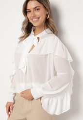 Biała Wiskozowa Bluzka Zdobiona Wiązaniem i Falbanami z Transparentną Wstawką Filomia. Białe bluzki damskie Born2be, m, z aplikacjami, z jeansu, eleganckie, bez kołnierzyka, bez ramiączek. Za 99.99 zł.