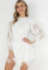 Biała Koronkowa Sukienka Mini z Asymetrycznym Dołem Trudy. Białe sukienki damskie Born2be, bez wzorów, z koronki, bez ramiączek. Za 269.99 zł.