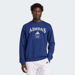 Bluza adidas Heritage Graphic Crew. Niebieskie bluzy damskie Adidas, s, bez wzorów, z bawełny, bez kaptura. Za 351.05 zł.
