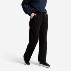 Spodnie damskie Domyos essential. Czarne spodnie sportowe damskie DOMYOS, l, bez wzorów, z materiału, na fitness i siłownię. Za 69.99 zł.