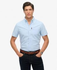Superdry Oxford Short Sleeve Shirt – koszula Oxford krótki rękaw 100% bawełna. Niebieskie koszule damskie Superdry, s, bez wzorów, z bawełny, casualowe, bez kołnierzyka, bez ramiączek. Za 280.80 zł.