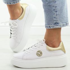 Białe skórzane sneakersy damskie na platformie Filippo Dp6058/25. Białe obuwie sportowe damskie Filippo, na jesień, ze skóry, bez zapięcia. Za 239.00 zł.