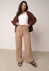 Beżowe Szerokie Spodnie z Teksturalnej Tkaniny z Wiązaniem w Pasie Agatia. Brązowe spodnie materiałowe damskie Born2be, bez wzorów, z jeansu, długie. Za 59.99 zł.