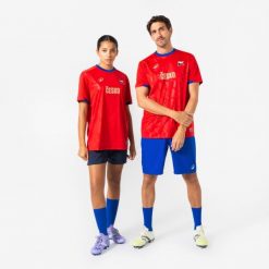 Koszulka piłkarska Czechy 2026 dla kibiców. Czerwone bluzki damskie KIPSTA, s, bez wzorów, z materiału, sportowe, bez kołnierzyka, bez ramiączek. Za 44.99 zł.