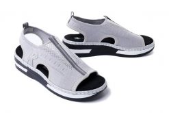 RIEKER V59B5-90 metallic, sandały damskie. Szare sandały damskie Rieker, bez wzorów, bez obcasa, na koturnie, bez zapięcia. Za 255.92 zł.