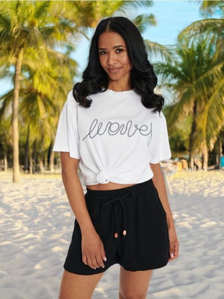 Koszulka - biały. Białe koszulki damskie Sinsay, l, bez wzorów, z bawełny, bez kołnierzyka, bez ramiączek. Za 25.99 zł.