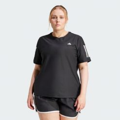 Koszulka Own The Run (Plus Size). Czarne bluzki damskie Adidas, plus size, bez wzorów, z materiału, sportowe, bez kołnierzyka, plus size, bez ramiączek. W wyprzedaży za 104.30 zł.