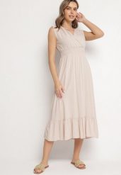Beżowa Wiskozowa Sukienka o Kopertowym Kroju z Falbanką Uliria. Brązowe sukienki damskie Born2be, bez wzorów, z wiskozy, eleganckie, bez ramiączek. Za 89.99 zł.