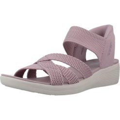 Sandały SKECHERS SLIP-INS ARYA Fioletowy. Fioletowe sandały damskie Skechers, bez wzorów, z materiału, bez obcasa, bez zapięcia. Za 390.00 zł.