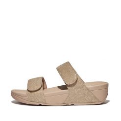 Kobiece klapki na koturnie FitFlop Lulu Adjustable. Brązowe klapki damskie FIT FLOP, bez wzorów, z materiału, bez obcasa, na koturnie, bez zapięcia. Za 473.00 zł.
