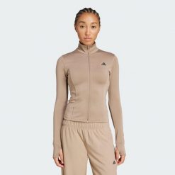 Kurtka Optime Essentials Full-Zip. Brązowe kurtki damskie Adidas, bez wzorów, bez kaptura. W wyprzedaży za 164.25 zł.