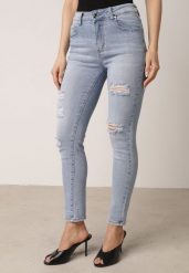 Niebieskie Bawełniane Jeansy o Kroju Slim z Przetarciami Elledima. Niebieskie jeansy damskie Born2be, bez wzorów, z bawełny. Za 109.99 zł.