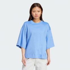 Luźna koszulka Soft Lux. Niebieskie bluzki damskie Adidas, xl, bez wzorów, bez kołnierzyka, bez ramiączek. Za 199.00 zł.