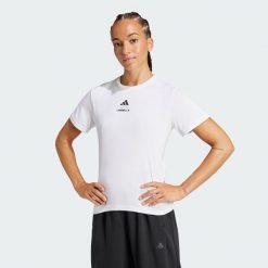 Koszulka Les Mills Graphic Tank. Białe koszulki damskie Adidas, l, bez wzorów, bez kołnierzyka, bez ramiączek. Za 179.00 zł.
