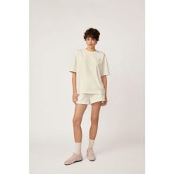 T-shirt Kubota ecru damski. Koszulki sportowe damskie Kubota, m, bez wzorów, z materiału, bez ramiączek. W wyprzedaży za 59.99 zł.