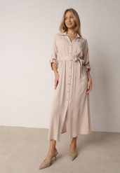 Jasnobeżowa Bawełniana Sukienka Koszulowa w Stylu Safari z Wiązanym Paskiem Atusea. Brązowe sukienki damskie Born2be, bez wzorów, z bawełny, casualowe, bez ramiączek. Za 159.99 zł.