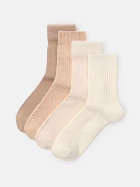 Długie prążkowane skarpety 4 pack - beżowy. Brązowe skarpetki damskie Sinsay, bez wzorów, prążkowane. Za 17.99 zł.