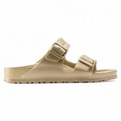 Klapki Birkenstock Arizona 1022465 złoty. Żółte klapki damskie bez wzorów, z materiału, bez obcasa, bez zapięcia. Za 361.45 zł.