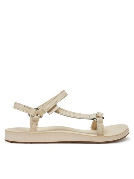 Teva Sandały Original Universal Slim 1151031 Écru. Białe sandały damskie Teva, bez wzorów, ze skóry, bez obcasa, na płaskiej podeszwie, bez zapięcia. Za 312.99 zł.