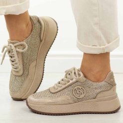 Złote skórzane sneakersy damskie Jezzi Ol39-5. Żółte obuwie sportowe casual damskie Jezzi, z jeansu, bez zapięcia. W wyprzedaży za 251.10 zł.