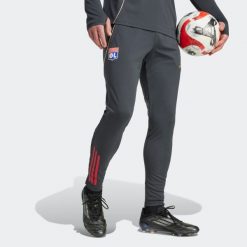 Spodnie piłkarskie treningowe ADIDAS Olympique Lyonnais 25/26. Rurki damskie Adidas, bez wzorów. Za 299.99 zł.