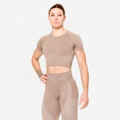 Koszulka fitness damska Domyos krótki rękaw crop top. Brązowe koszulki damskie DOMYOS, l, bez wzorów, z materiału, bez kołnierzyka, bez ramiączek. W wyprzedaży za 59.99 zł.