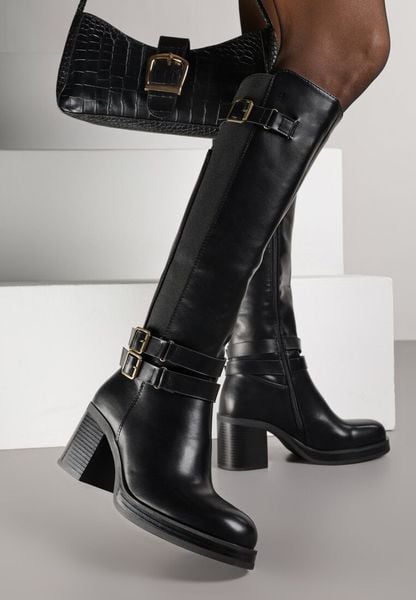 Czarne Kozaki na Słupku Zdobione Paskami z Klamrami i Elastyczną Wstawką Unelisa. Czarne kozaki damskie Born2be, z jeansu, bez obcasa, na obcasie, bez zapięcia. Za 209.99 zł.