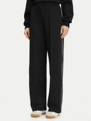 Guess Spodnie dresowe V6BB05 K6265 Czarny Regular Fit. Czarne spodnie dresowe damskie Guess, m, z aplikacjami, z dresówki. Za 394.99 zł.