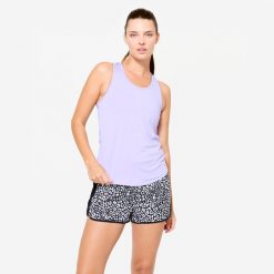 Koszulka fitness damska Domyos bez rękawów. Fioletowe koszulki damskie DOMYOS, l, bez wzorów, z elastanu, bez kołnierzyka, bez ramiączek. Za 19.99 zł.