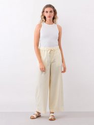 IVY & OAK Spodnie w kolorze jasnożółtym rozmiar: 34. Żółte spodnie materiałowe damskie IVY & OAK, bez wzorów, z materiału. Za 140.53 zł.