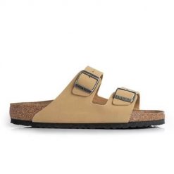 Klapki damskie Birkenstock Arizona. Żółte klapki damskie Birkenstock, bez wzorów, z materiału, bez obcasa, bez zapięcia. Za 425.35 zł.