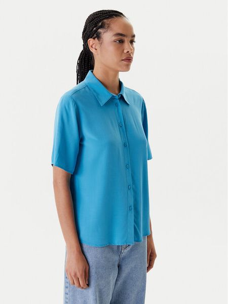 United Colors Of Benetton Koszula 5WPWDQ0B1 Niebieski Regular Fit. Niebieskie koszule damskie United Colors Of Benetton, s, bez wzorów, z wiskozy, bez kołnierzyka, bez ramiączek. Za 89.99 zł.