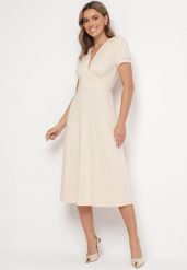 Jasnobeżowa Sukienka Rozkloszowana z Wiskozą z Poduszkami w Ramionach Awerla. Brązowe sukienki damskie Born2be, bez wzorów, z wiskozy, eleganckie, bez ramiączek. Za 179.99 zł.