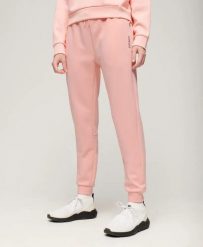 Superdry Slimowe Spodnie Sportowe z Jersey – Peach Pearl Pink. Czerwone spodnie sportowe damskie Superdry, bez wzorów, z bawełny. Za 273.60 zł.