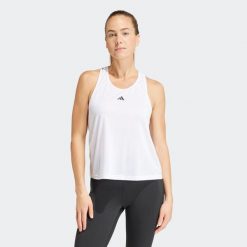 Koszulka fitness damska ADIDAS bez rękawów. Białe koszulki damskie Adidas, l, bez wzorów, z materiału, bez kołnierzyka, bez ramiączek. W wyprzedaży za 79.99 zł.