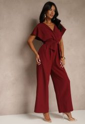 Bordowy Elegancki Kombinezon z Szerokimi Nogawkami i Kopertowym Dekoltem Melovina. Czerwone sukienki damskie Renee, bez wzorów, eleganckie, bez ramiączek. Za 69.99 zł.
