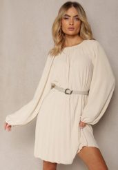 Jasnobeżowa Rozkloszowana Sukienka Ozdobiona Plisowaniem i Bufiastymi Rękawami Ksarina. Brązowe sukienki damskie Renee, bez wzorów, eleganckie, bez ramiączek. W wyprzedaży za 67.99 zł.