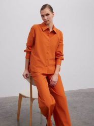 BGN Bluzka w kolorze pomarańczowym rozmiar: 34. Pomarańczowe bluzki damskie BGN, bez wzorów, bez kołnierzyka, bez ramiączek. Za 56.99 zł.